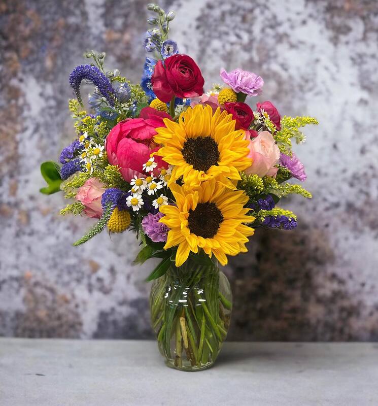 Mixed Summer Vase Arrangement with Sunflowers accented with shades of pink and purple